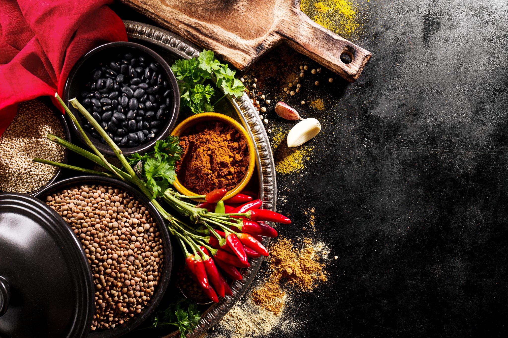 Beautiful Tasty Appetizing Ingredients Spices Grocery for Cooking Healthy Kitchen. Dark Black Background Horizontal Toning Copy Space